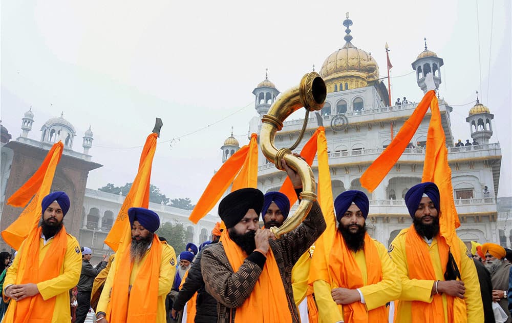 Panj Pyare members during a religious procession at the Golden Temple on the eve of birth anniversary of Guru Gobind Singh.