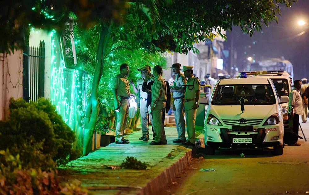 Police officials on spot where a low intensity bomb blast occurred at church street in Bengaluru.