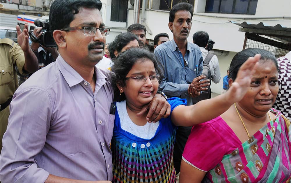 Family members of Bhawani Bala, the deceased in the Bengaluru blast, mourn outside a hospital in Bengaluru.