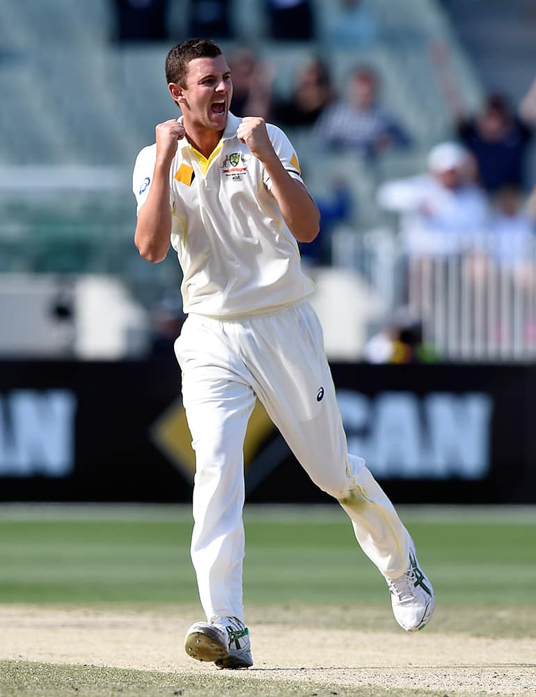 Australia's Josh Hazlewood celebrates taking the wicket of India's Ajinkya Rahane for 48 runs on the final day of their cricket test match in Melbourne, Australia.