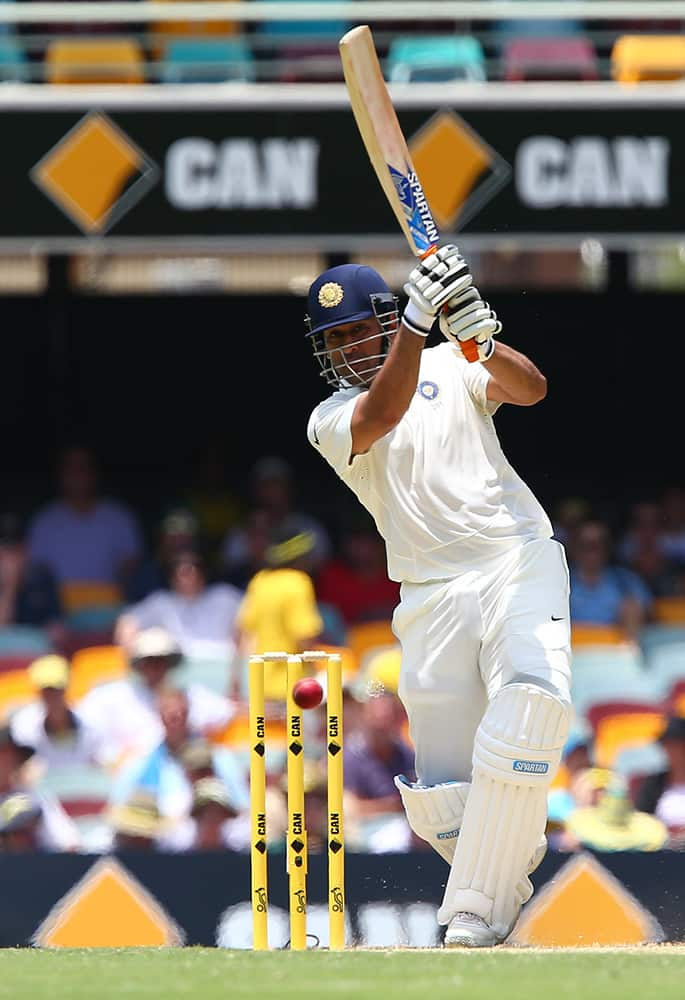 MS Dhoni plays a shot during play on day two of the second cricket test against Australia in Brisbane, Australia.