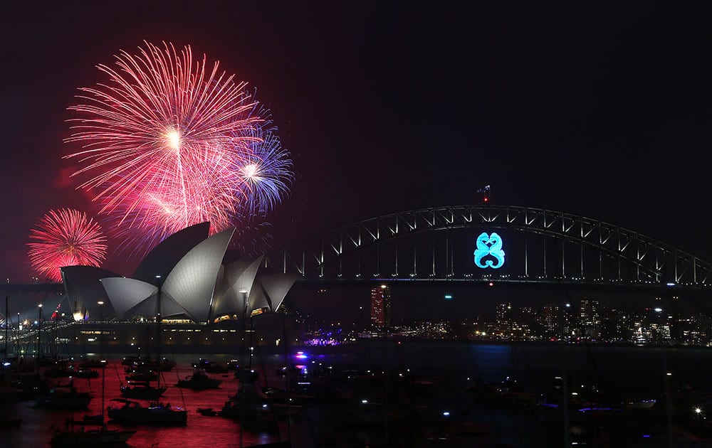 Fireworks explode over the Opera House and the Harbour Bridge during New Year's Eve celebrations in Sydney, Australia.