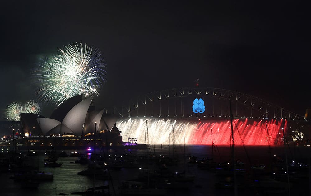 Fireworks explode over the Opera House and the Harbour Bridge during New Year's Eve celebrations in Sydney, Australia.