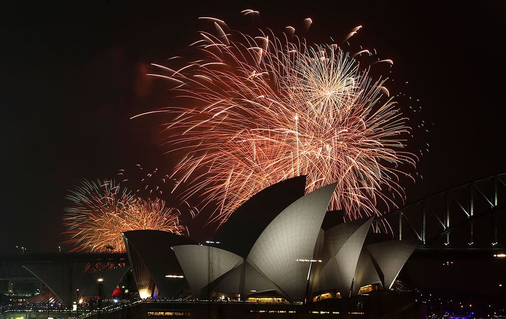 Fireworks explode over the Opera House and the Harbour Bridge during New Year's Eve celebrations in Sydney, Australia.