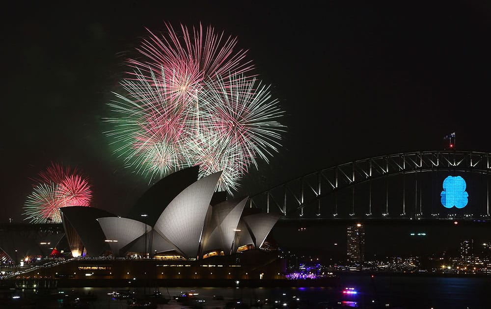 Fireworks explode over the Opera House and the Harbour Bridge during New Year's Eve celebrations in Sydney, Australia.