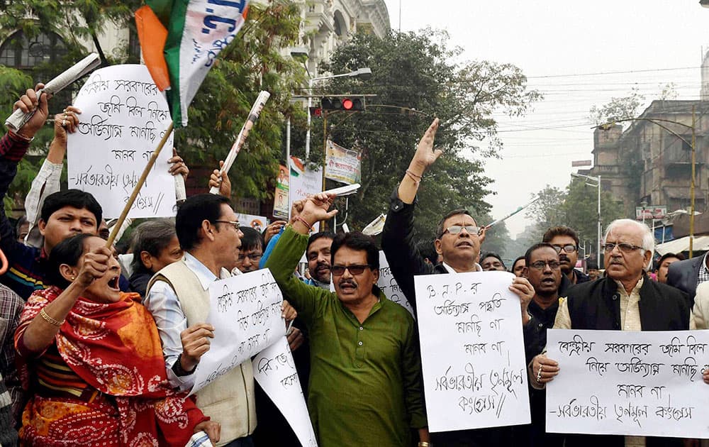 Trinamool Congress workers take out a protest rally aganist land ordinance in Kolkata.