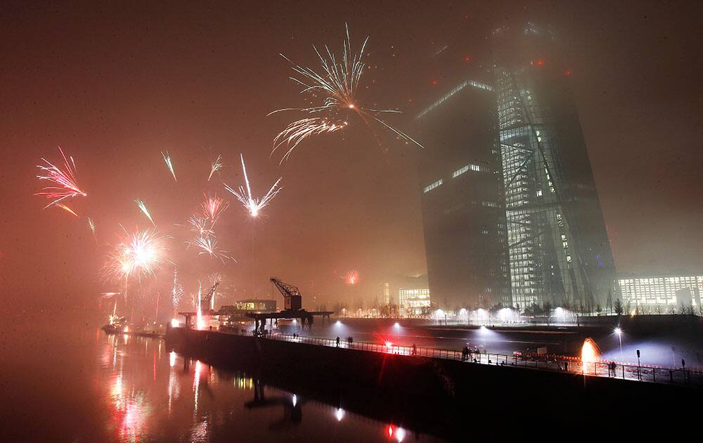 Fireworks explode during New Years celebrations near the new headquarters of the European Central Bank in Frankfurt, Germany.