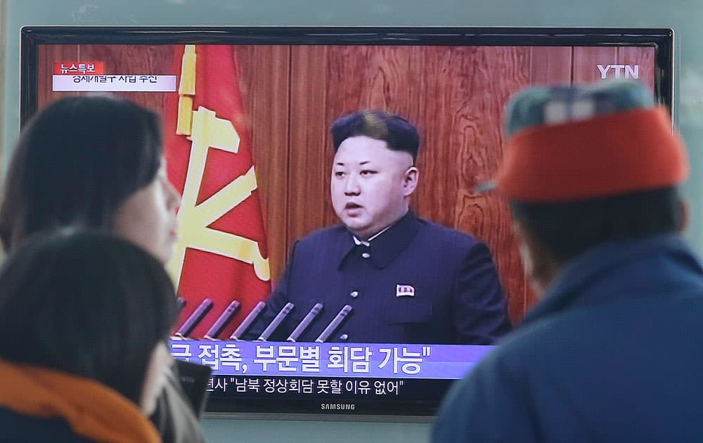 People watch a TV news program showing North Korean leader Kim Jong-Un delivering a speech, at the Seoul Railway Station in Seoul, South Korea.