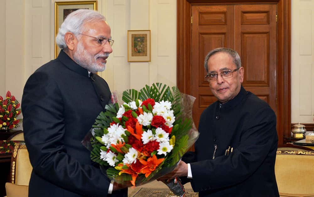President Pranab Mukherjee being greeted by Prime Minister Narendra Modi on the occasion of New Year at Rashtrapati Bhavan in New Delhi.