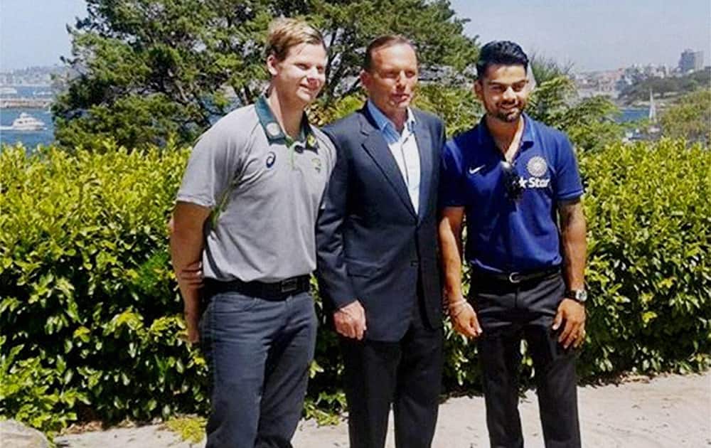Australian Prime Minister, Tony Abbott with Indian cricket Test team captain Virat Kohli and Australian captain Steven Smith during the afternoon tea hosted by PM Tony Abbott.