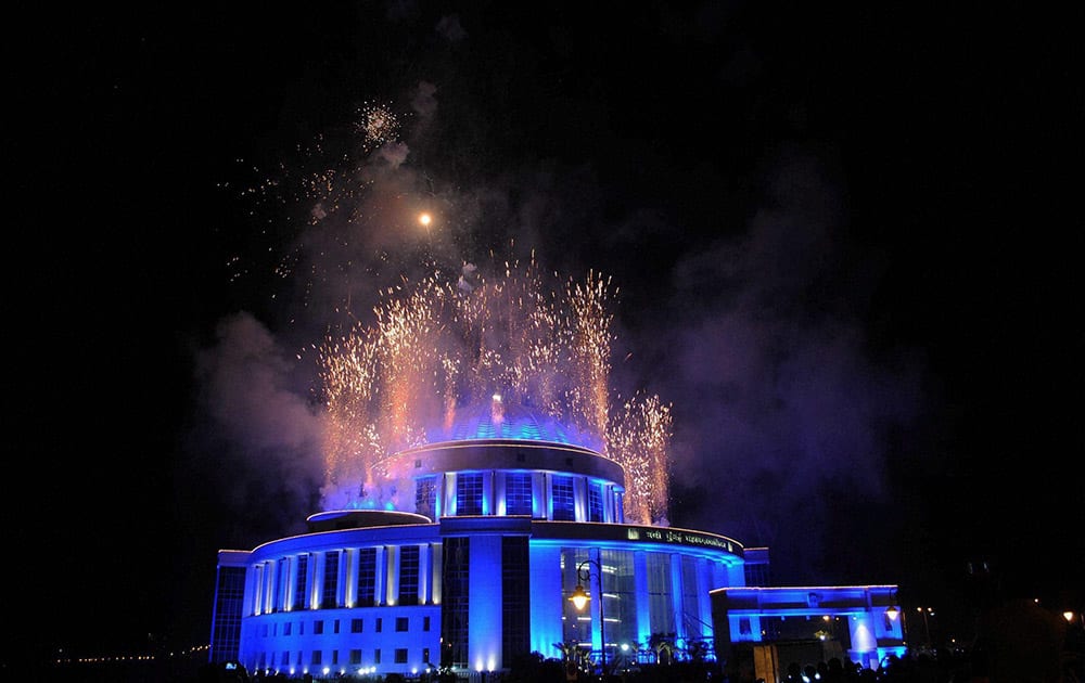 Fireworks go off at the Mahanagar Palika Building on New Years eve, in Navi Mumbai.