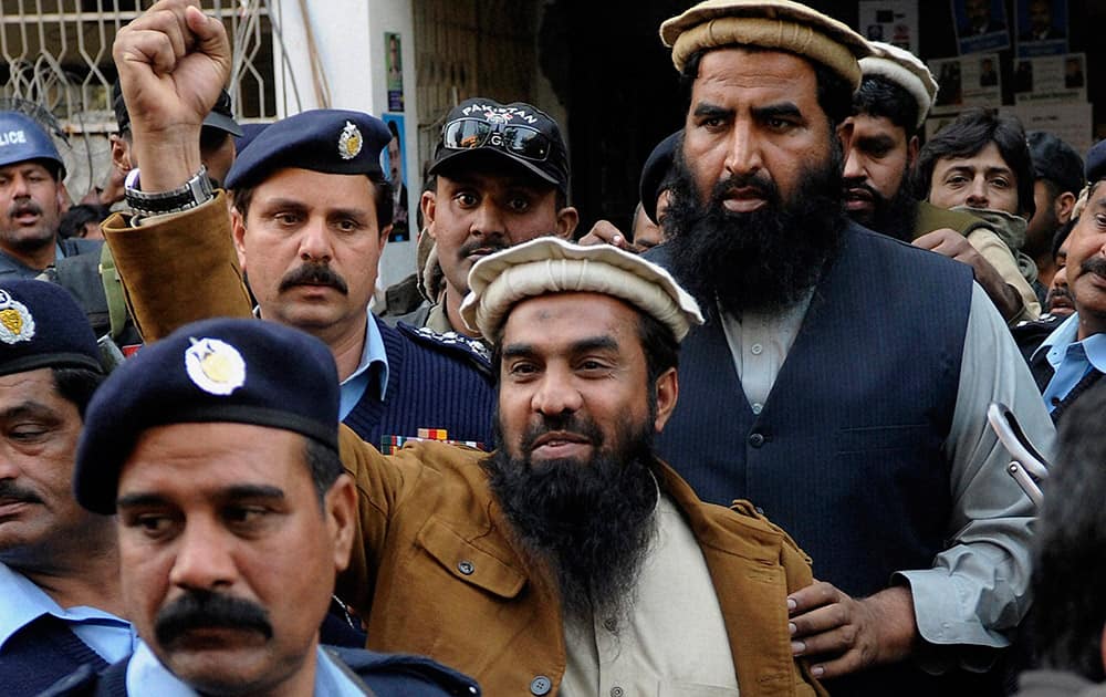  Zaki-ur-Rahman Lakhvi, the main suspect of the Mumbai terror attacks in 2008, raises his fist after his court appearance in Islamabad, Pakistan.