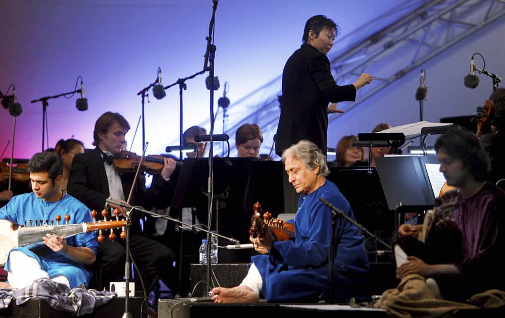 Sarod maestro Ustad Amjad Ali Khan with his sons Amaan and Ayaan Ali Khan, performs at the opening ceremony of the Dubai Shopping Festival in Dubai.