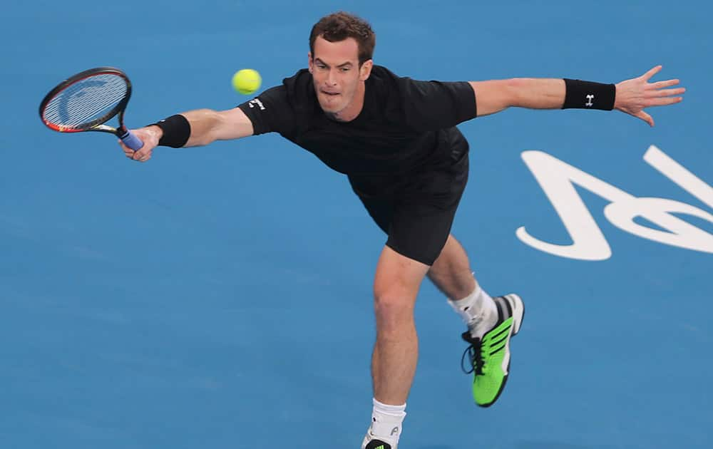 Britain's Andy Murray returns the ball to Feliciano Lopez of Spain during the first day of the Mubadala World Tennis Championship in Abu Dhabi, United Arab Emirates.