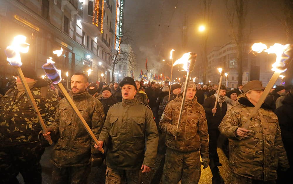 Ukrainian nationalists carry torches during a rally in downtown Kiev, Ukraine.