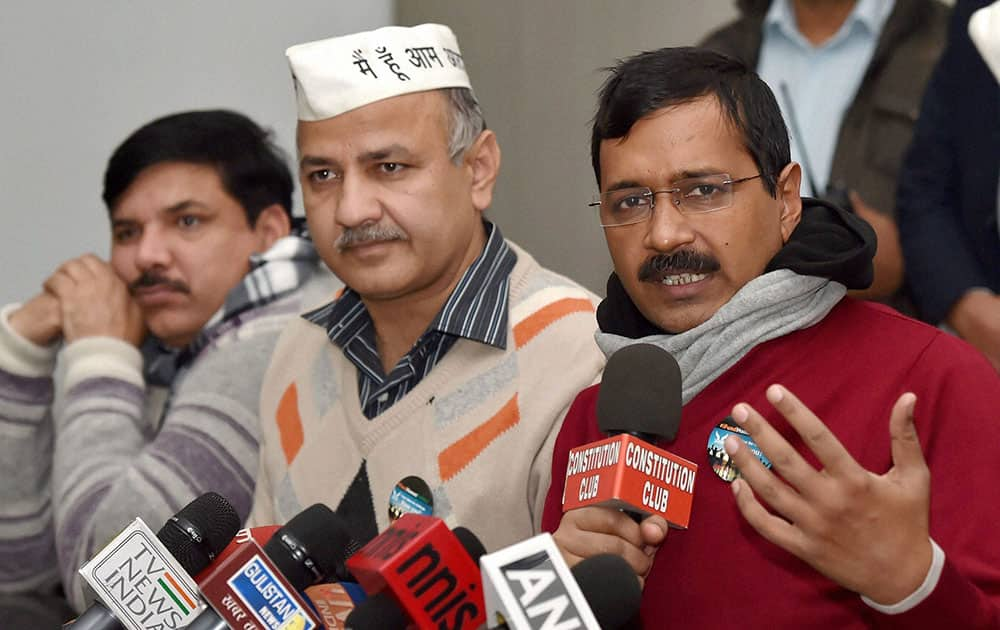 AAP convener Arvind Kejriwal with party leaders Manish Sisodia and Sanjay Singh addressing a press conference.