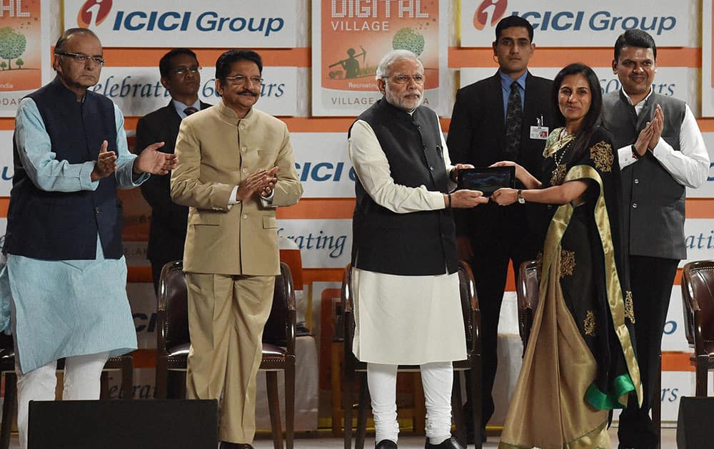 Prime Minister Narendra Modi along with ICICI Banks MD and CEO Chanda Kochhar, Finance Minister Arun Jaitley, Governor C Vidyasagar Rao and CM Devendra Fadnavis launch of ICICI group digital village project in Mumbai.