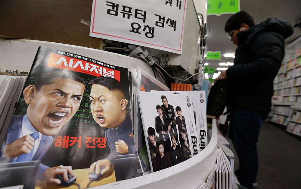 A magazine with cartoons of US President Barack Obama and North Korean leader Kim Jong Un is displayed at a book store in Seoul, South Korea.