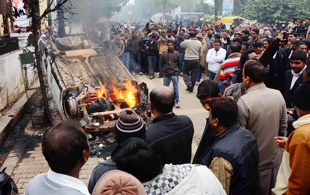 Angry advocates set ablaze the car of attackers who opened fire on an advocate at the District Court campus in Allahabad.