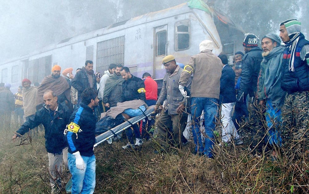 An injured is carried for treatment after a train hit a tractor at an unmanned crossing in Jalandhar.