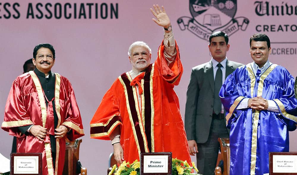 Prime Minister Narendra Modi waves during the 102nd Indian Science Congress 2015 at University of Mumbai on Saturday. Maharashtra Governor Vidyasagar Rao and Chief Minister Devendra Fadnavis are also seen.