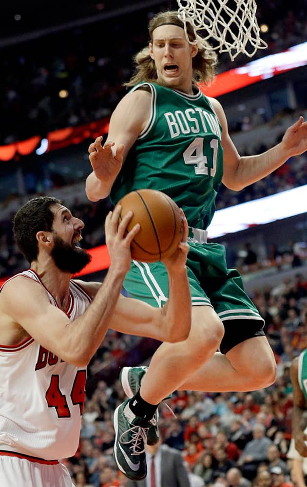 Chicago Bulls forward Nikola Mirotic (44) looks to the basket as Boston Celtics forward Kelly Olynyk (41) guards during the second half of an NBA basketball game in Chicago.