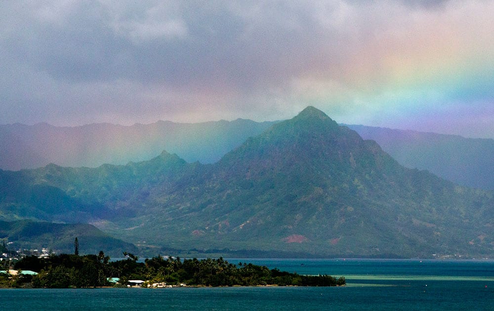 President Barack Obama's motorcade passes Kaneohe Bay as heads for the beach at Bellows Air Force Station, on the island of Oahu in Hawaii, on the final day of the Obama family vacation. 