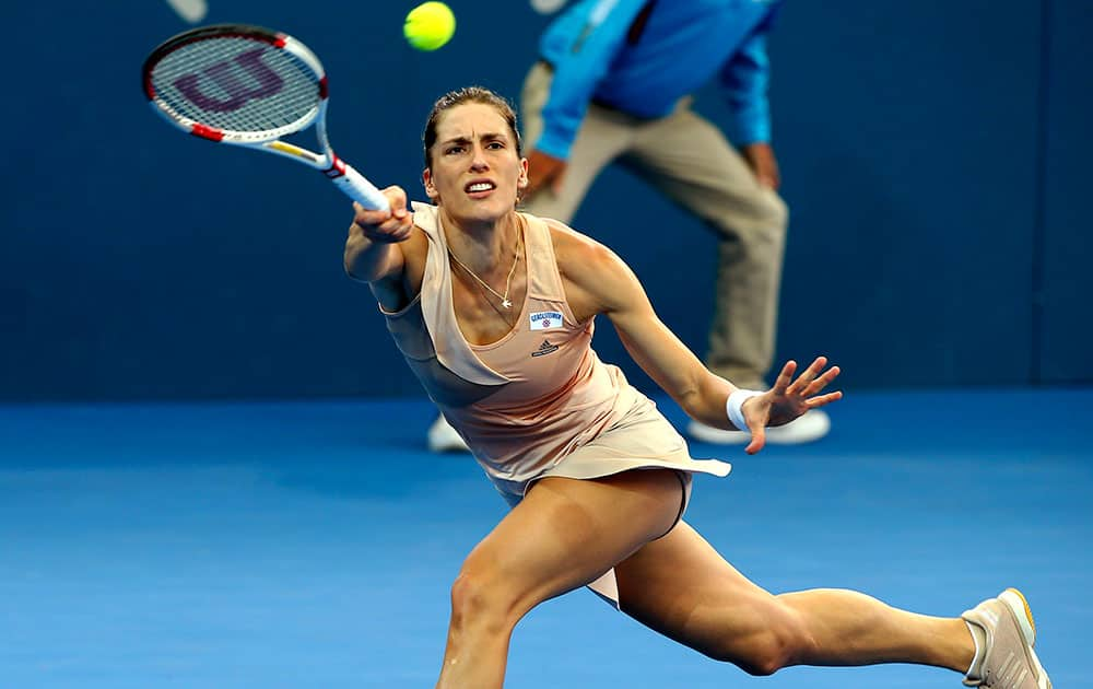 Andrea Petkovic of Germany plays a shot during her first round match against Estonia's Kaia Kanepi at the Brisbane International tennis tournament in Brisbane, Australia.