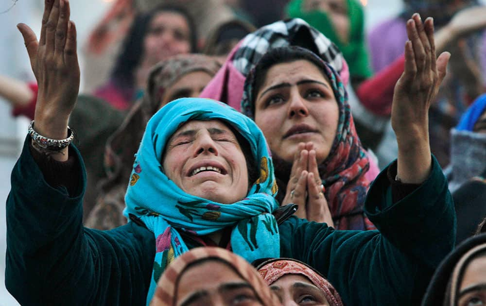 A Kashmiri woman cries as she prays at the Hazratbal shrine on Eid-e-Milad, or birth anniversary of Islam’s Prophet Muhammed in Srinagar.