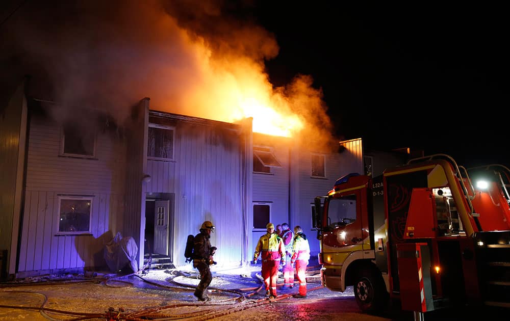 Three people were found dead inside a flat in a burning building in Solbergelva, some 40 km south of Oslo.