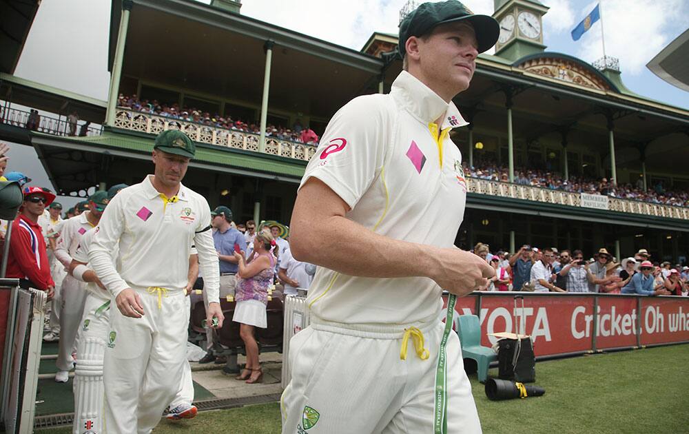 Australia's captain Steve Smith leads his team out for the opening ceremony for their cricket test match against India in Sydney.