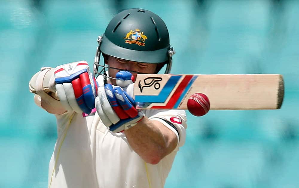 Australia's Chris Rogers pulls the ball against India during their cricket test match in Sydney.