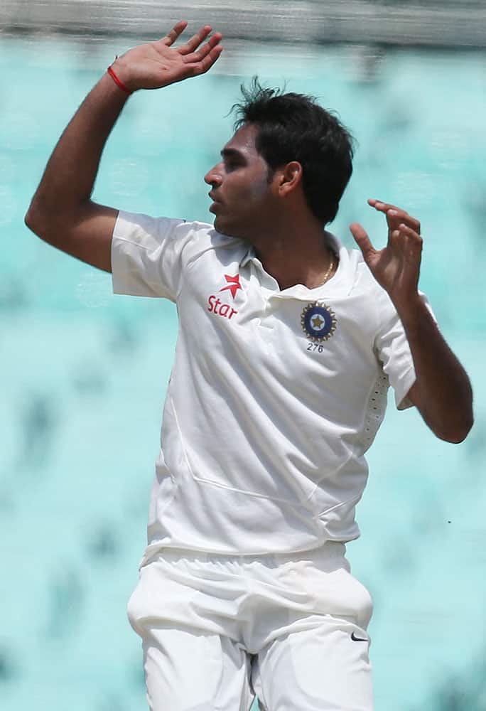 India's India's Bhuvneshwar Kumar reacts to Australia making runs off his bowling during their cricket test match in Sydney