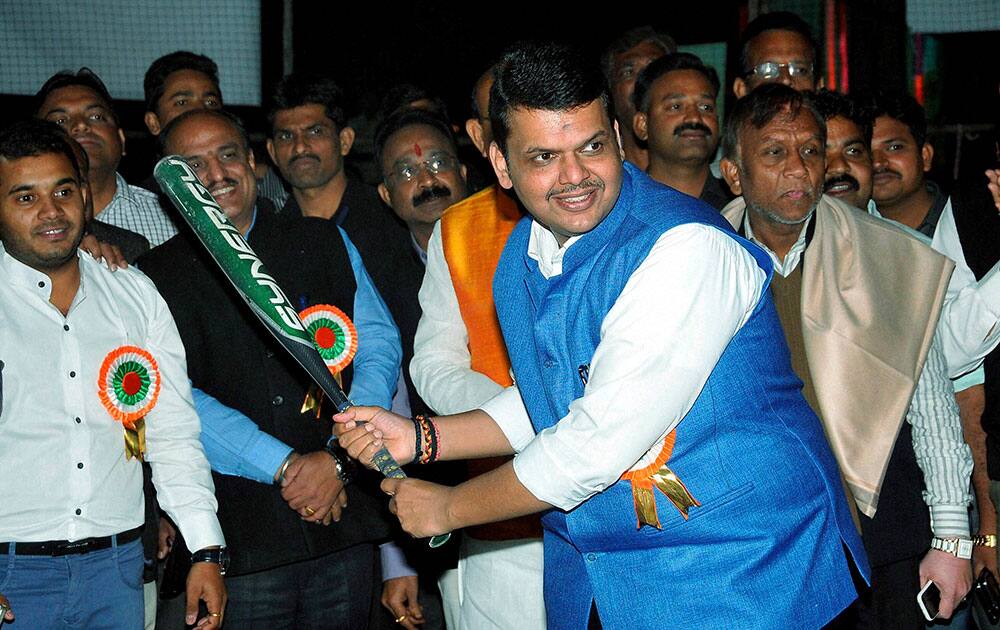 Maharashtra Chief Minister Devendra Fadnavis in action during the 36th National Softball Championship for Mens and Women in Nagpur.