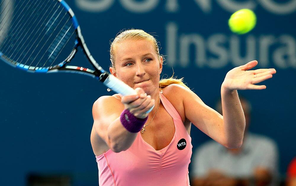 Alla Kudryavtseva of Russia plays a shot in her match against Karolina Pliskova of the Czech Republic during the Brisbane International tennis tournament.