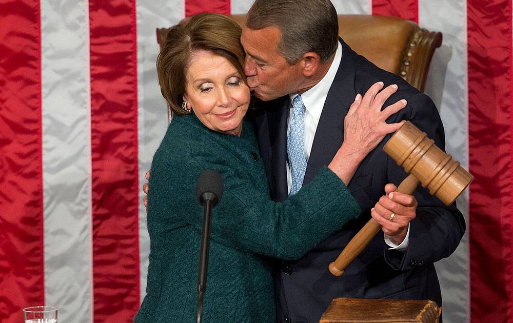 House Speaker John Boehner of Ohio, kisses House Minority Leader Nancy Pelosi of Calif. after being re-elected to a third term during the opening session of the 114th Congress, as Republicans assume full control for the first time in eight years on Capitol Hill in Washington.