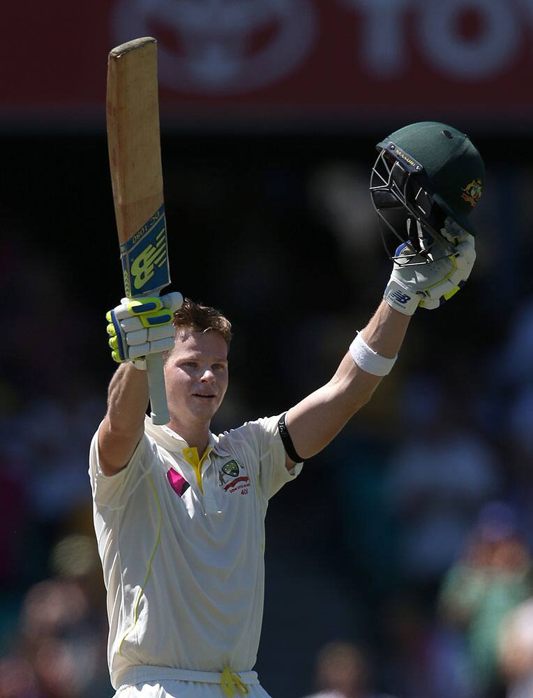 Australia's Steve Smith celebrates making 100 runs against India on the second day of their cricket test match in Sydney.