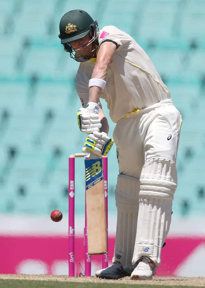 Australia's Steve Smith edges a ball that will have him caught out for 117 runs against India on the second day of their cricket test match in Sydney.