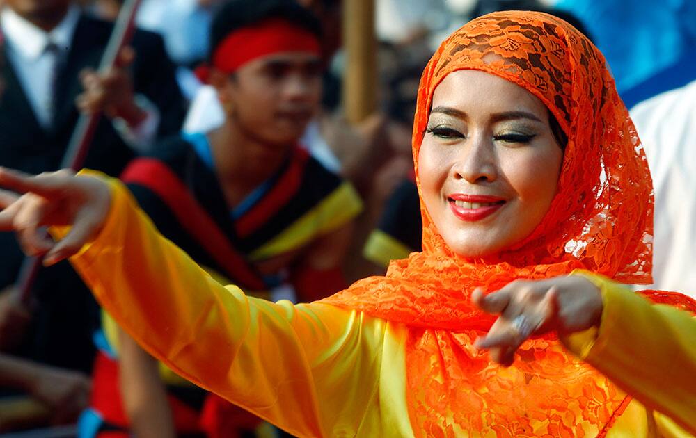 A Cambodian dancer performs during an event by the ruling Cambodian People's Party marking the 36th anniversary of the 1979 downfall of the Khmer Rouge regime, at their party headquarters in Phnom Penh, Cambodia.