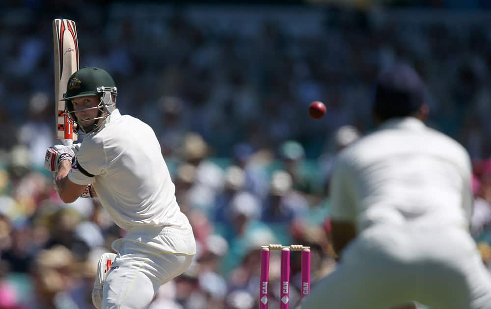 Australia's Shaun Marsh, turns to see the ball he has nicked heading toward the Indian wicketkeeper Wriddhiman Saha to be caught out for 73 runs on the second day of their cricket test match in Sydney.