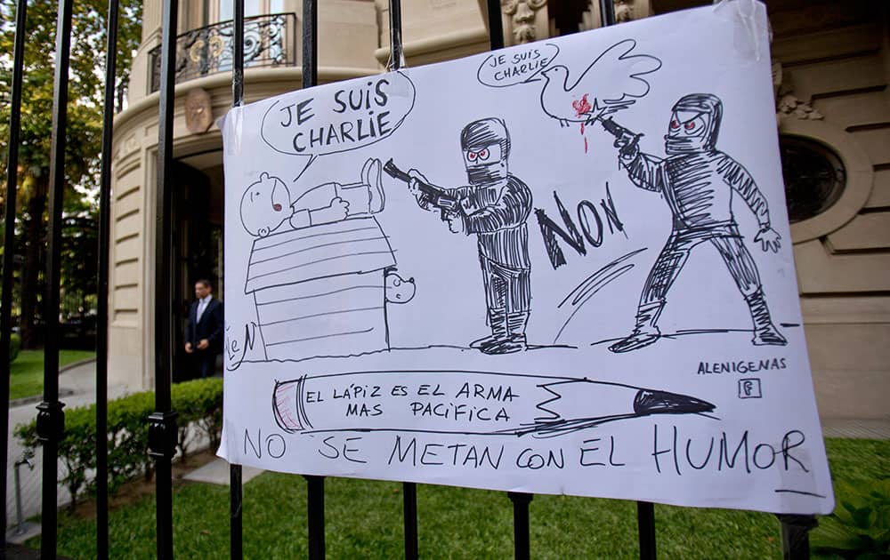 A cartoon style drawing hangs outside France's embassy that reads in Spanish 