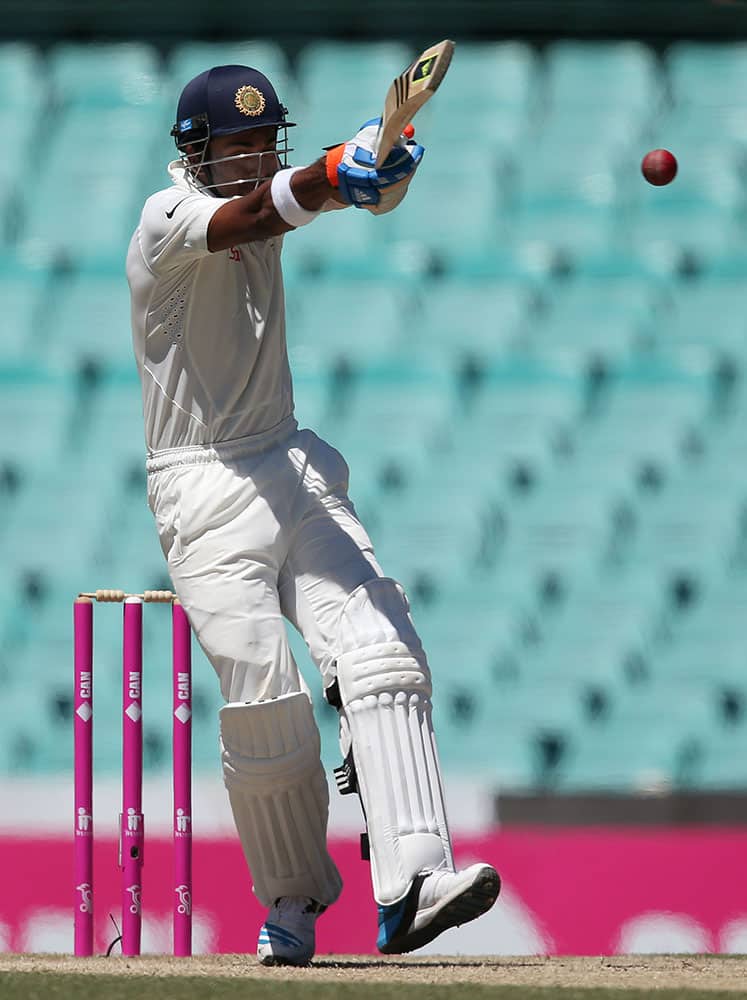 India's Lokesh Rahul hooks the ball from Australia's Josh Hazelwood on the third day of their cricket test match in Sydney.