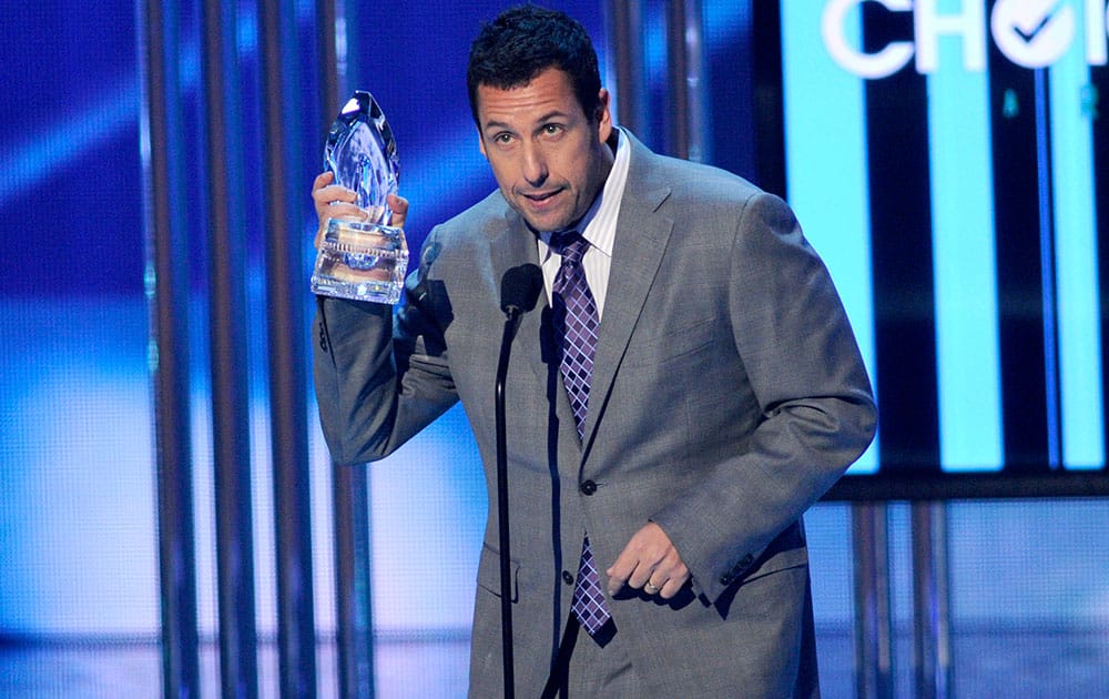 Adam Sandler accepts the award for favorite comedic movie actor at the People's Choice Awards at the Nokia Theatre.