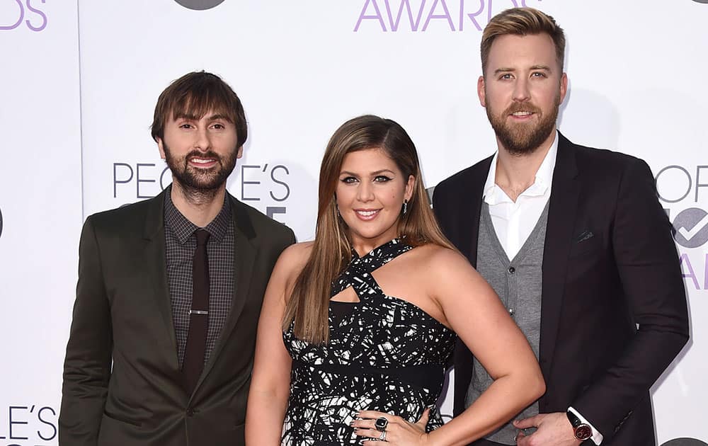 Dave Haywood, from left, Hillary Scott and Charles Kelley of Lady Antebellum arrive at the People's Choice Awards at the Nokia Theatre.