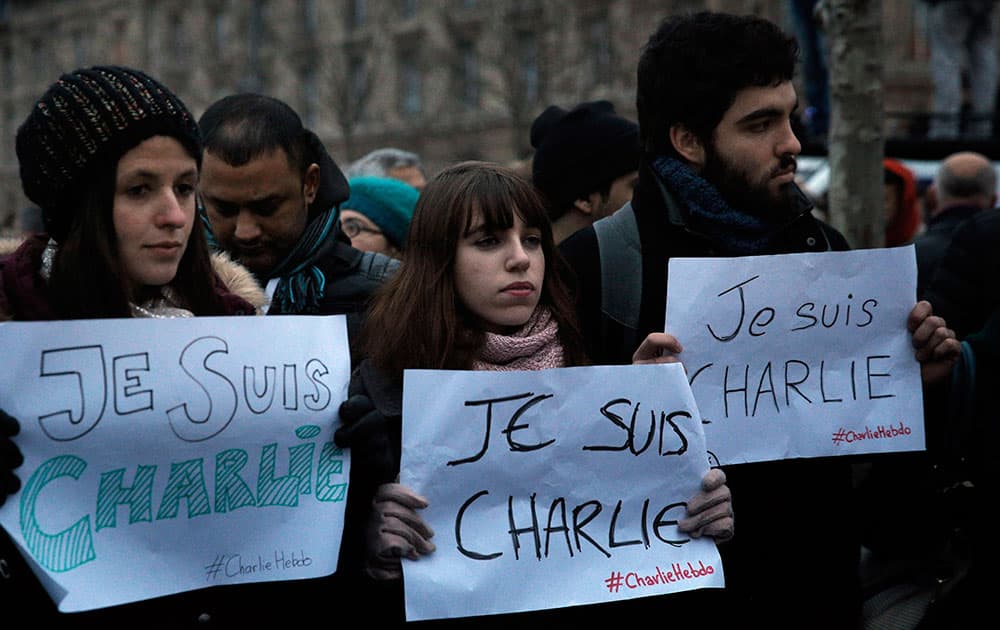Demonstrators hold papers reading 'I am Charlie', during a demonstration in Paris.