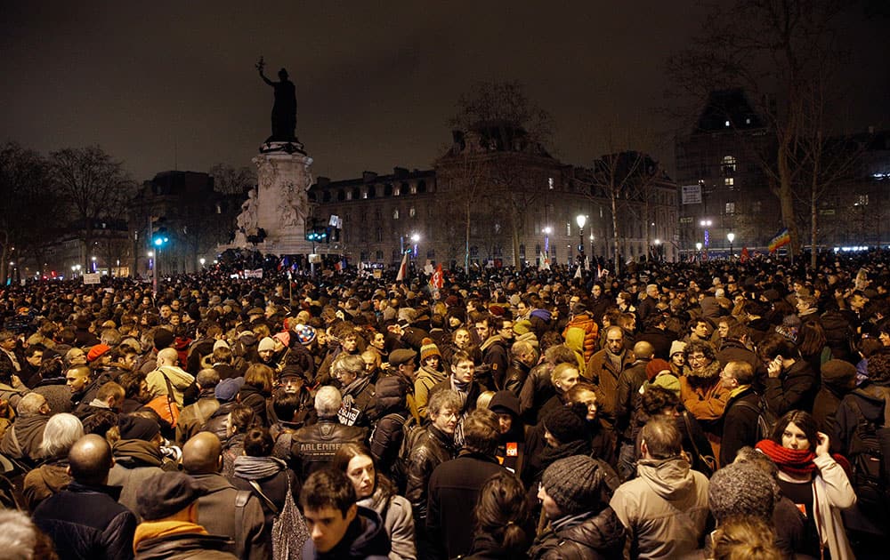 Demonstrators gather at the Place de la Republique after a shooting at a French satirical newspaper in Paris, France.