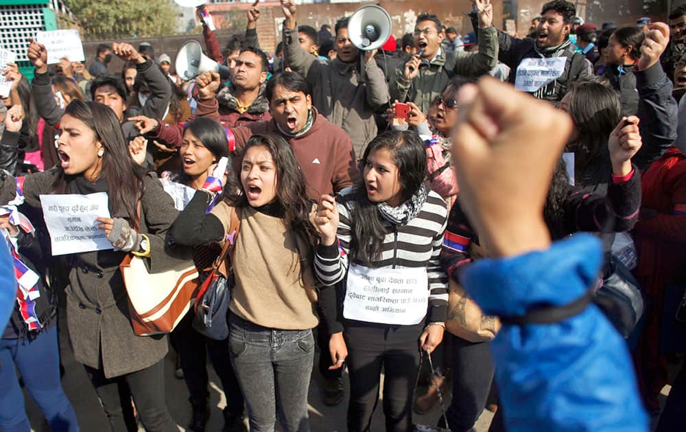 Nepalese activists shout slogans during a protest demanding provision in the new constitution to avail citizenship in the name of one's mother, in Katmandu, Nepal.