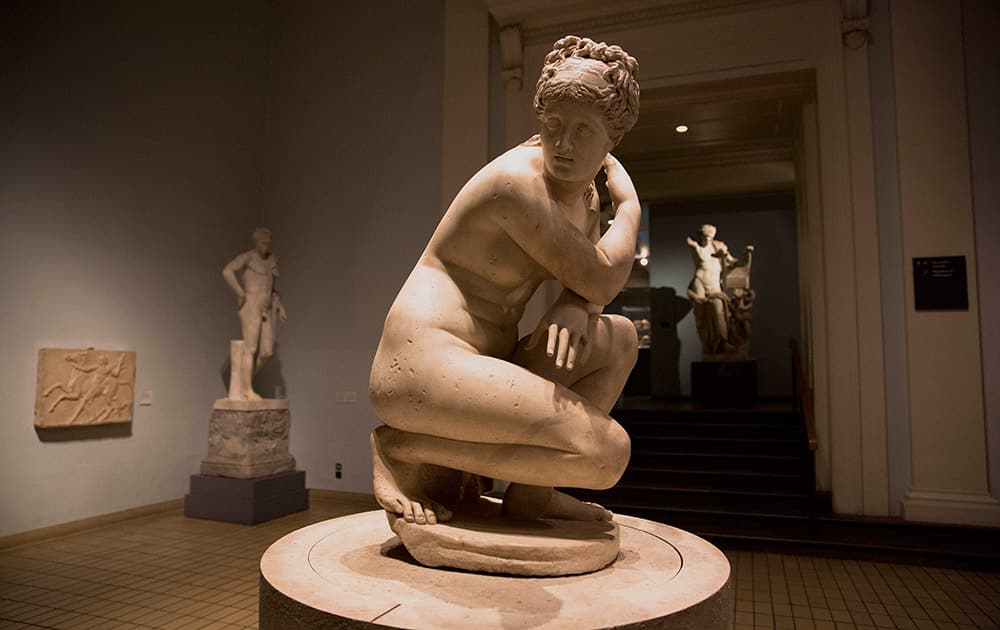 A 2nd century AD Roman marble copy of a Greek original statue of Greek goddess Aphrodite crouching naked at her bath, also known as Lely's Venus, is seen on display during a media photo opportunity to promote a forthcoming exhibition on the human body in ancient Greek art at the British Museum in London.