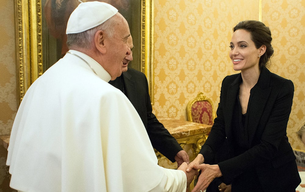 Pope Francis meets Angelina Jolie during a private audience at the Vatican.