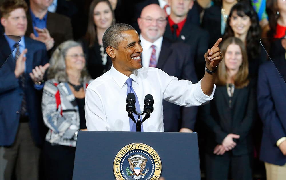 President Barack Obama smiles as he gives a speech about housing and home ownership as he announces a cut in mortgage insurance premiums on Federal Housing Administration loans, a move aimed at attracting new homebuyers, at Central High School in Phoenix. 